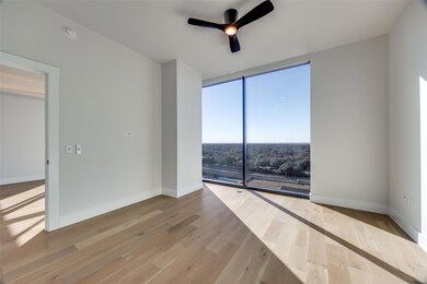 Spare room with ceiling fan, light wood-type floor