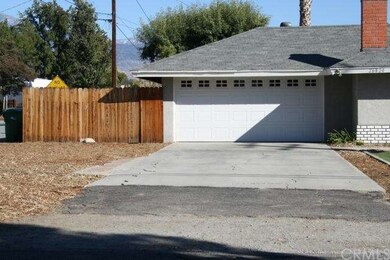 Two car garage with RV parking in side and rear of