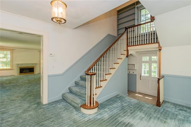 Front foyer with gracious stairway and views of th