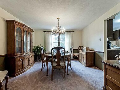 Dining Room. New neutral carpeting in DR with chai