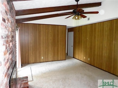 The Family Room has Paneling on Two Walls and Expo