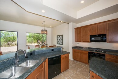 Open kitchen finished in granite