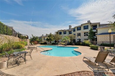Community pool featuring fence, a patio, and a re