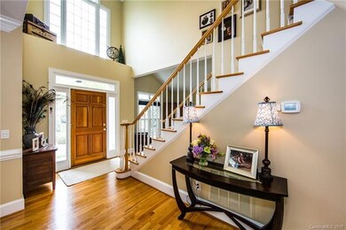 Two story foyer offers so much natural light.  Har