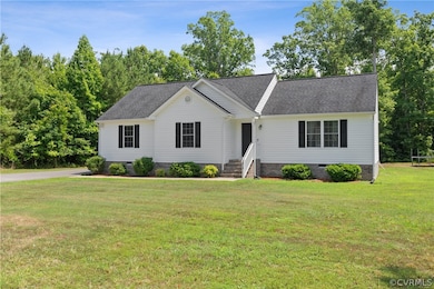 Ranch-style house featuring a front yard