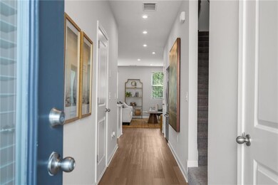 Corridor with recessed lighting and dark wood-style floors