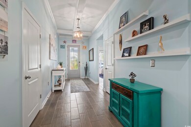 Foyer entrance with dark hardwood / wood-style flo