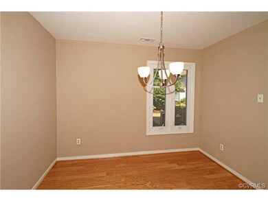 The dining room has new hardwood floor and light f
