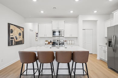 (Photo of decorated model, actual homes colors and finishes will vary) Open and naturally bright, the home's kitchen space is highly desirable