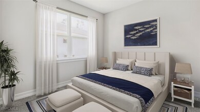 Bedroom featuring baseboards and carpet