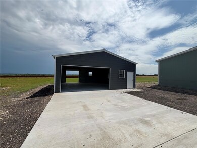 Detached garage featuring driveway