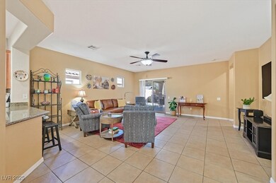 Living area featuring light tile patterned floors,