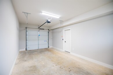 Garage with garage door opener.