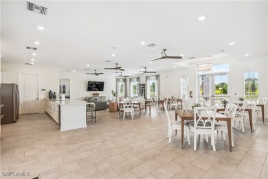 Dining area with ornamental molding and sink