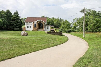 Front of house from Midway Drive. Long cement priv