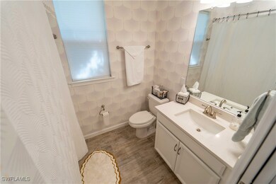 Bathroom featuring hardwood / wood-style floors, v