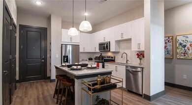 Kitchen featuring appliances with stainless steel 