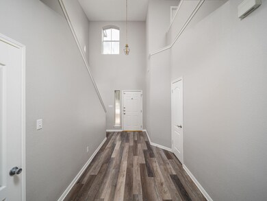 Doorway to outside featuring dark wood-style floo