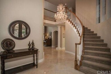 Large formal entry with sweeping staircase.  Yes, 