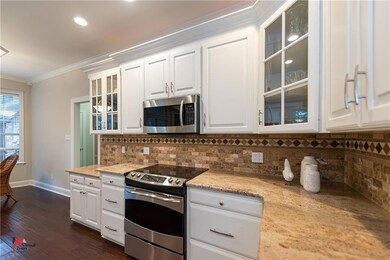 Kitchen is loaded with crisp white cabinetry!