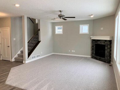 The corner fireplace and wrought iron spindles do 