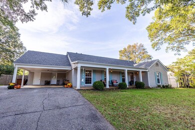 Ranch-style house with a front yard, a porch, and 