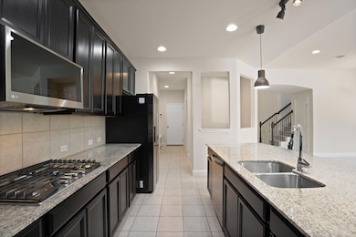 Kitchen featuring stainless steel appliances, a s
