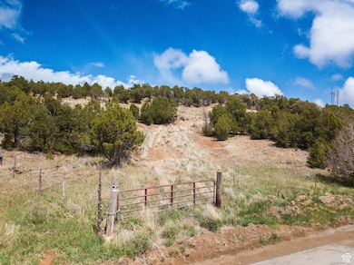 View of yard featuring a rural view and fence