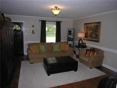 Living room was recently painted and new wrought i