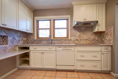 Small eating bar or desk in kitchen.