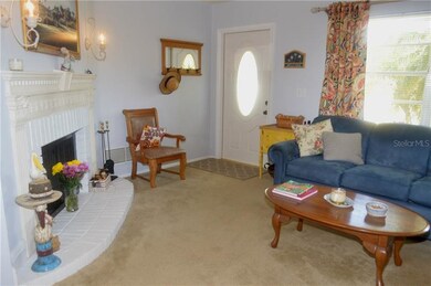 Living room with a large window letting in a lot o