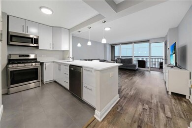 Kitchen with stainless steel appliances, light cou