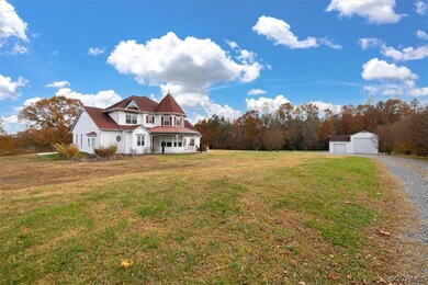 View of front facade with a garage and a front lawn