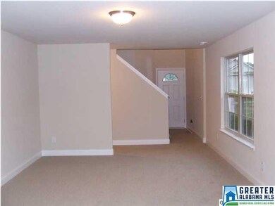 Living room looking toward the front door. Sloped 