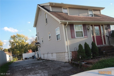 Traditional-style home with a shingled roof