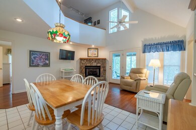 Dining space with ceiling fan, track lighting, lig