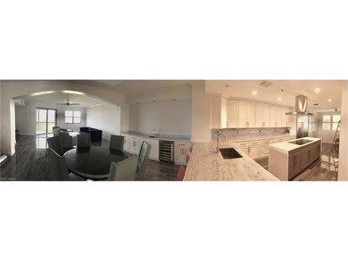 View of breakfast nook, kitchen, dining room with wet bar and wine fridge and living room. 6