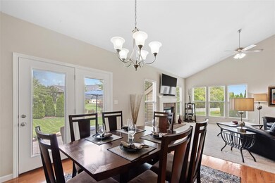 The breakfast room has an atrium door with glass enclosed blinds that opens to the stamped concrete patio!