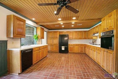Spacious Kitchen with Kintile flooring, beaded and