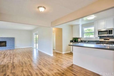 Kitchen opens to formal dining and family room.