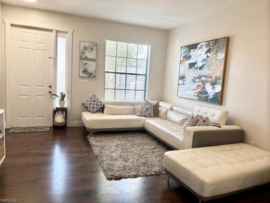 Living room featuring dark wood-type flooring and 