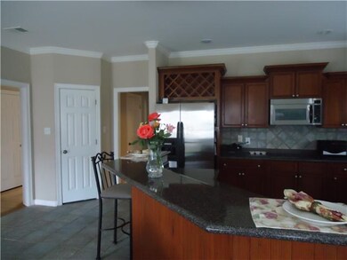 This view shows the breakast bar in kitchen and ha