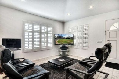 Recessed lighting in living room, plantation shutt