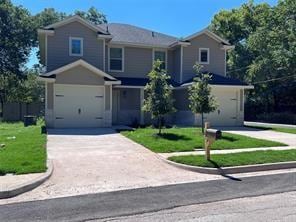 Traditional-style home featuring concrete driveway