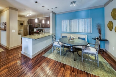 Kitchen with decorative light fixtures, stainless 