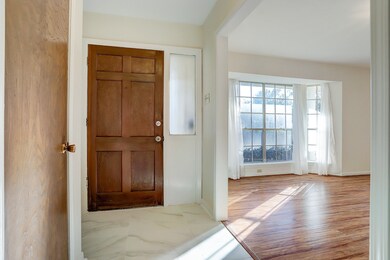 The entry opens to a spacious, light and bright li