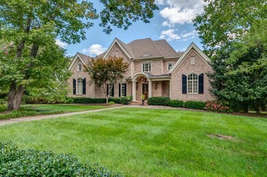1477 Willowbrooke Circle. Pretty front entry with gas lanterns & double doors.  5 bedrooms all with private baths. 2 half baths and 3 car garage.