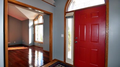 Large Foyer Looking Into The Living Room With Stun