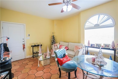 Living room featuring ceiling fan