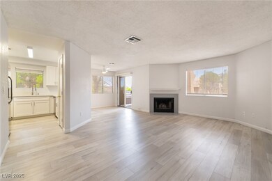 Unfurnished living room with a textured ceiling, l
